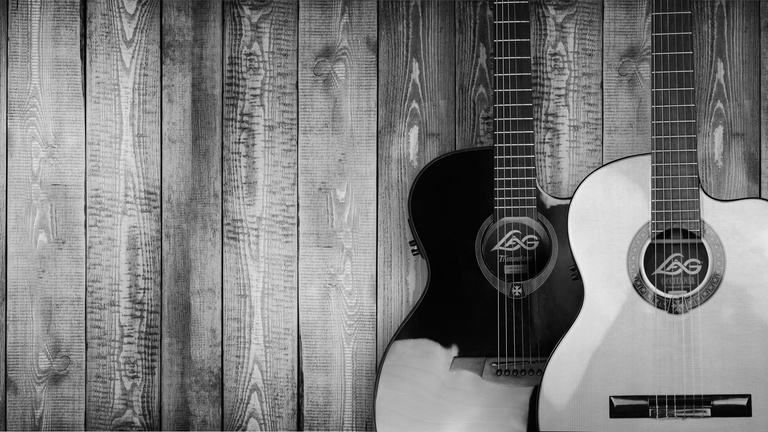 Black and White Top View of Guitars on Wooden Background